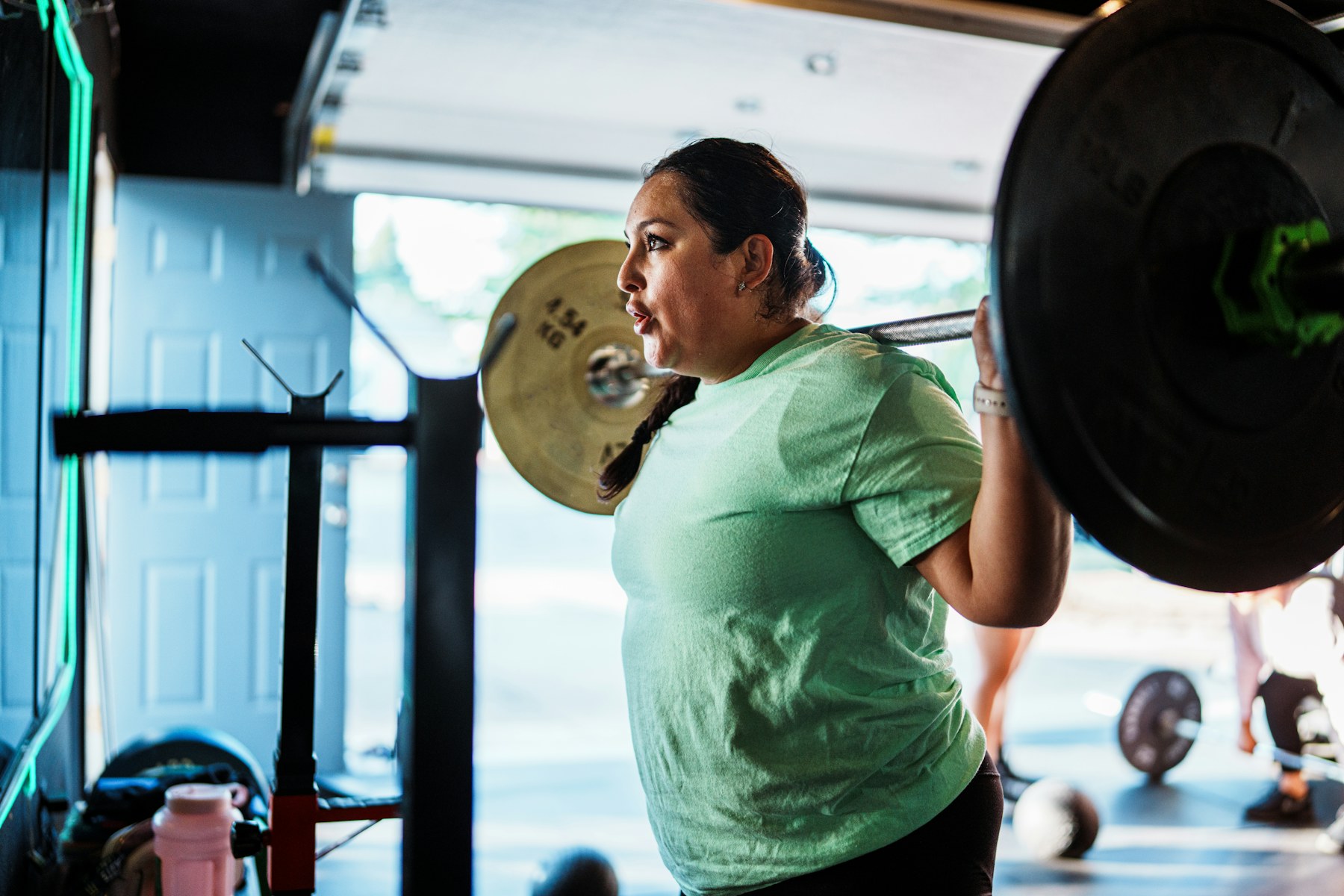 A woman lifting weights during a gym workout